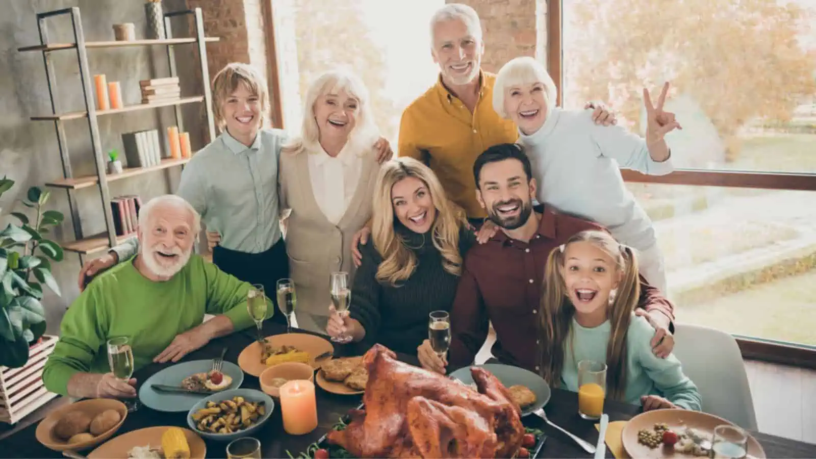 Photo of big family standing hugging feast table holiday roasted turkey