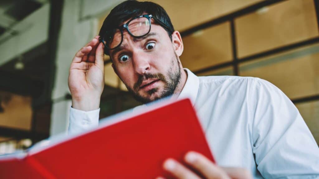 Shocked emotional male entrepreneur very surprised