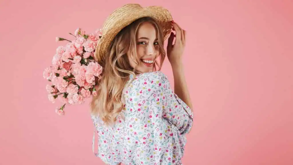 woman holding carnations