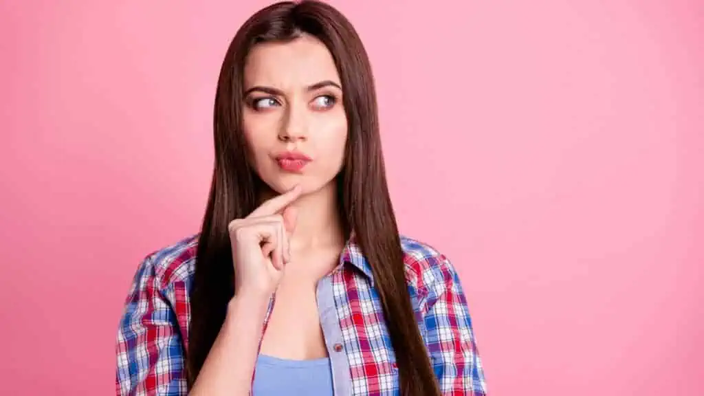 woman thinking with finger on chin