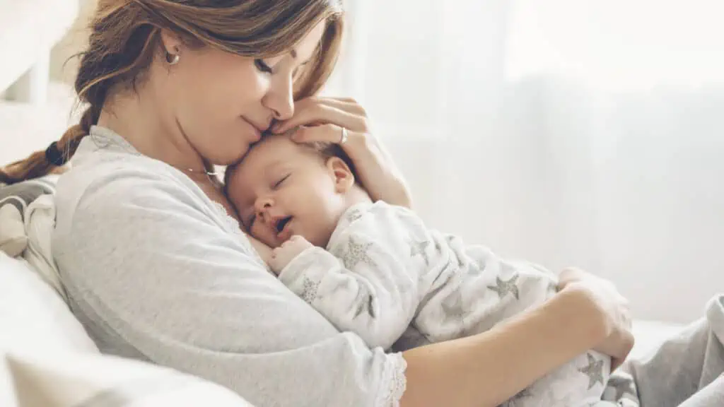 mom with baby sleeping on her chest