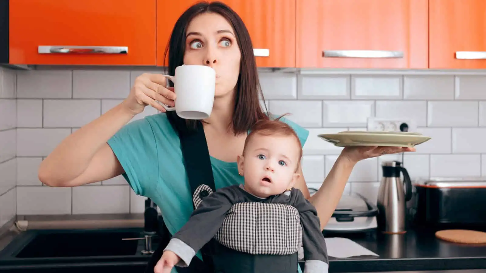 mom with baby multitasking