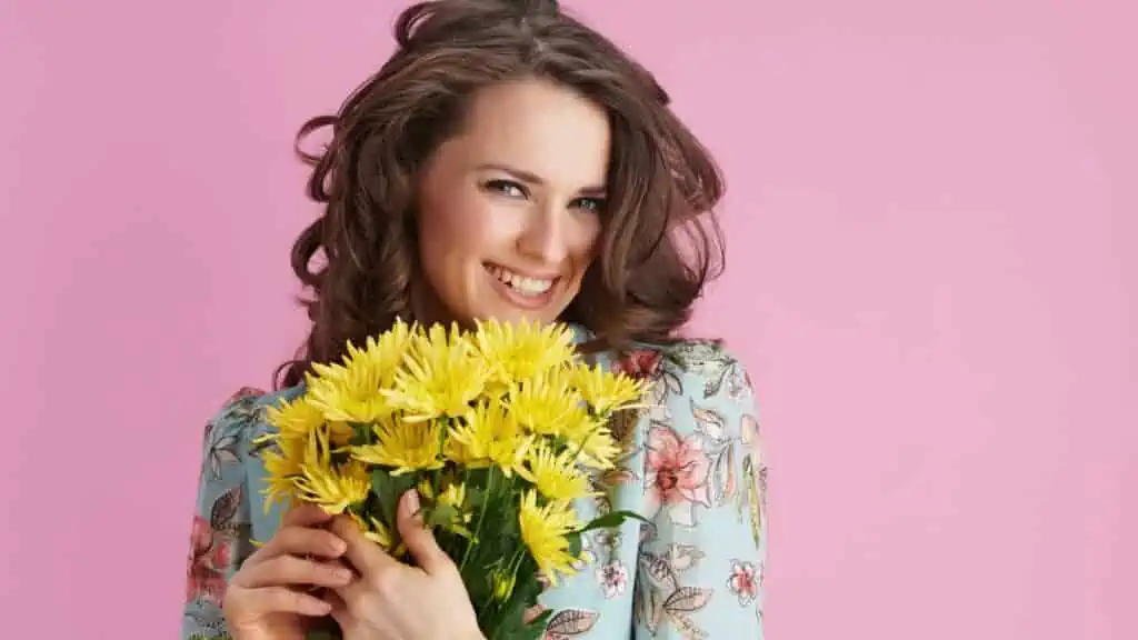 woman yellow flowers chrysanthemum