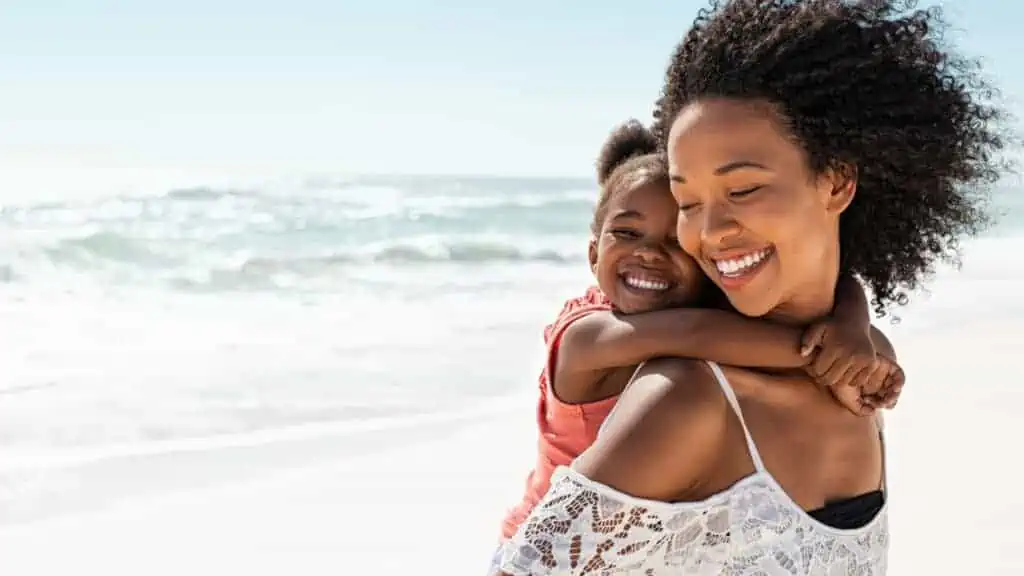 mom and girl on beach