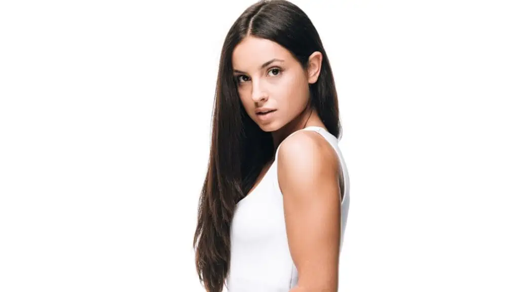 Side view of brunette beautiful woman with long straight healthy hair