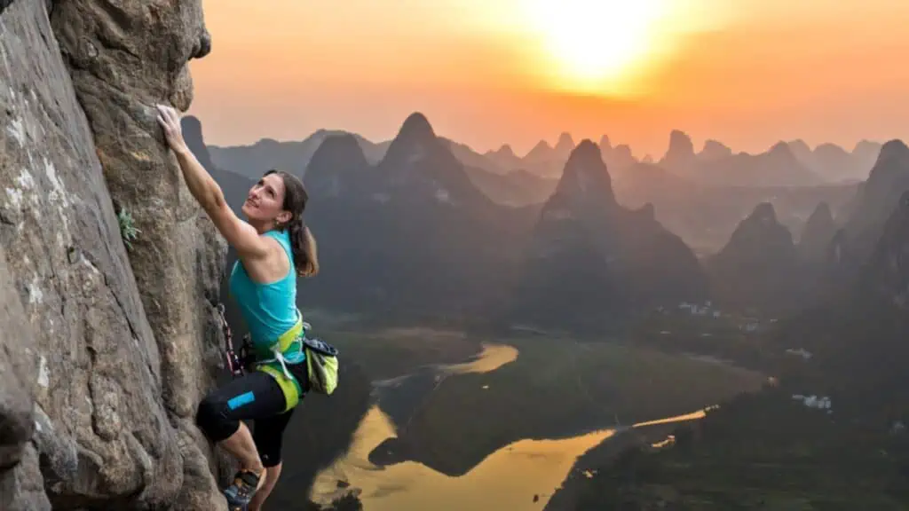 Silhouette of female athlete on Chinese mountain sunset