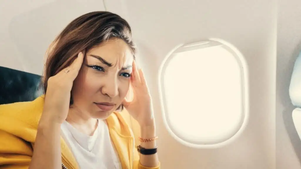 Stressed woman on an airplane