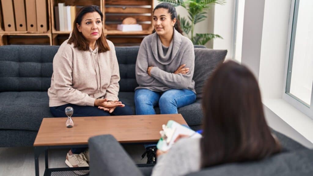 Three woman mother and daughter having psychology therapy