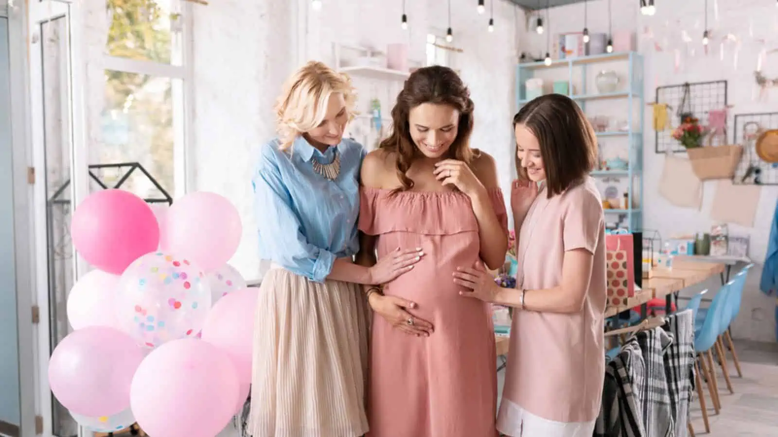 Two businesswomen celebrating baby shower of their sister