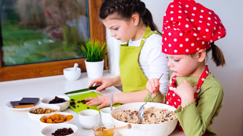 Two sisters preparing granola together