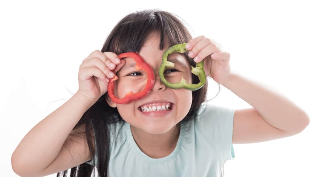 girl laughing smiling eating healthy food