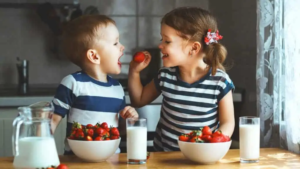 kids eating strawberries healthy kitchen