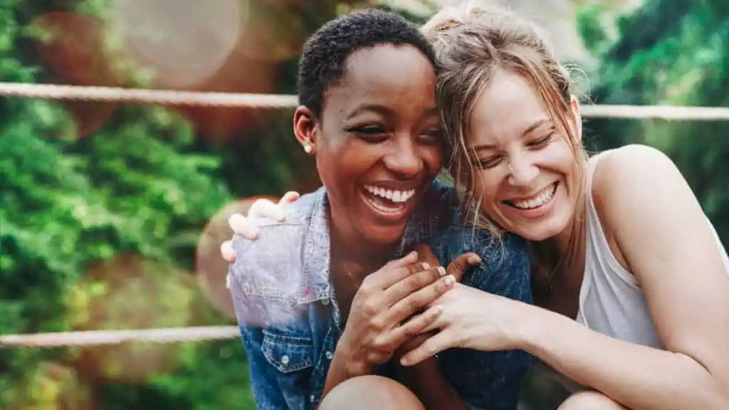 two women laughing together