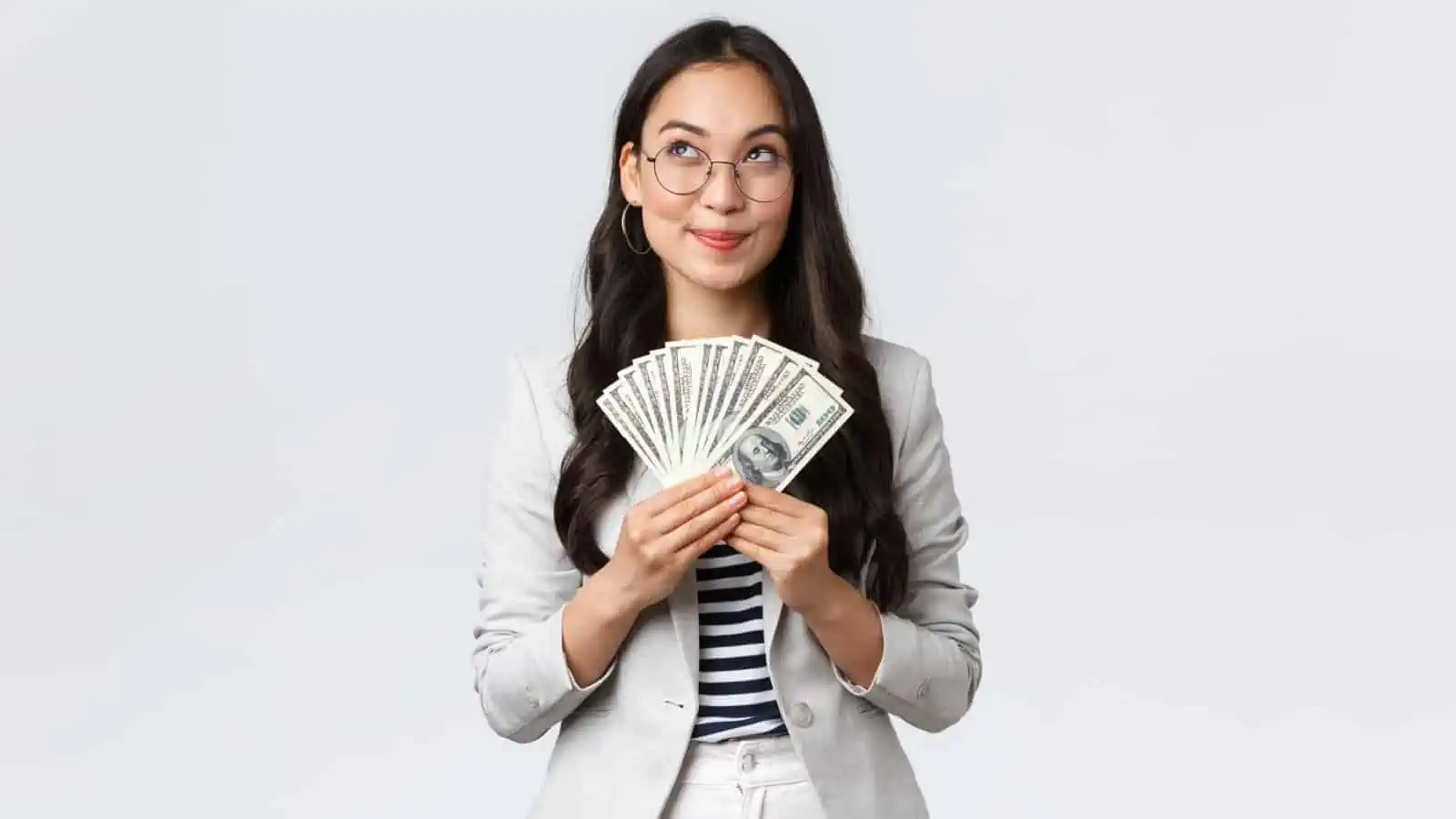 woman holding money and happy