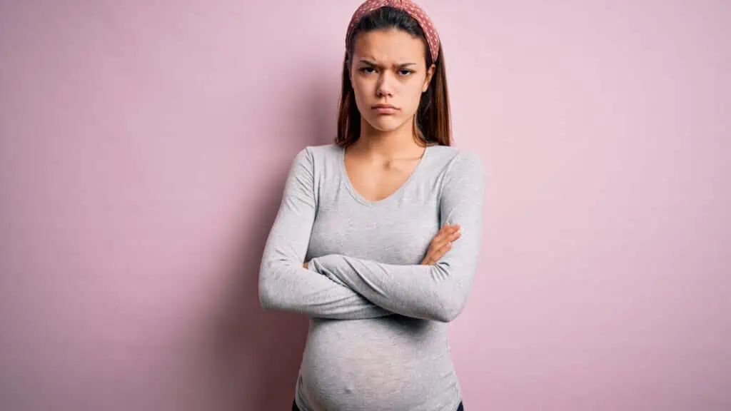 mad pregnant woman frustrated arms crossed