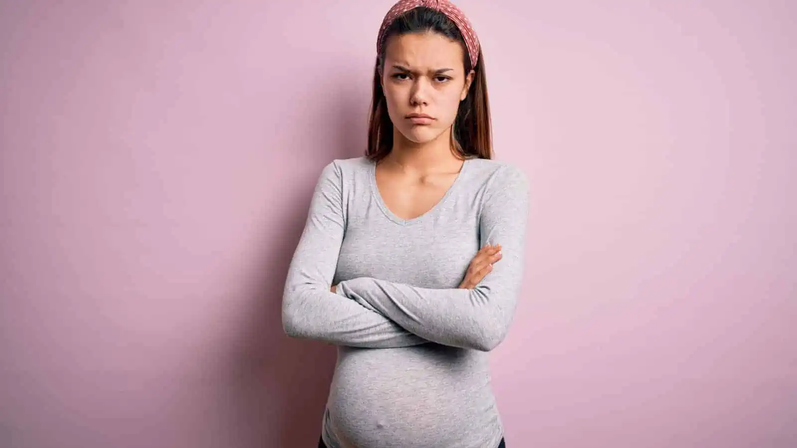 mad pregnant woman frustrated arms crossed