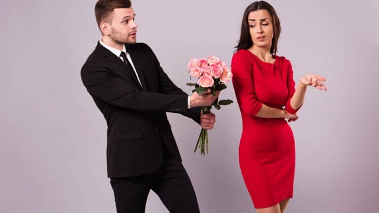 fighting couple man offering flowers roses sorry red dress suit
