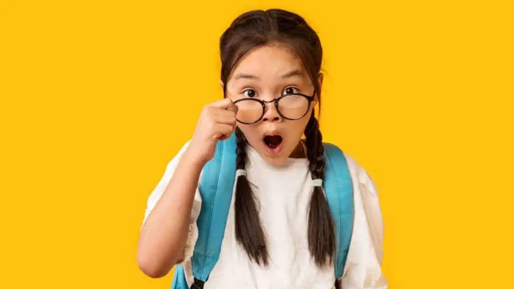 school girl with glasses braids shocked surprised
