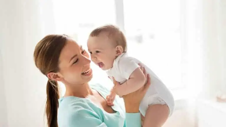 mom and baby smiling and laughing happy