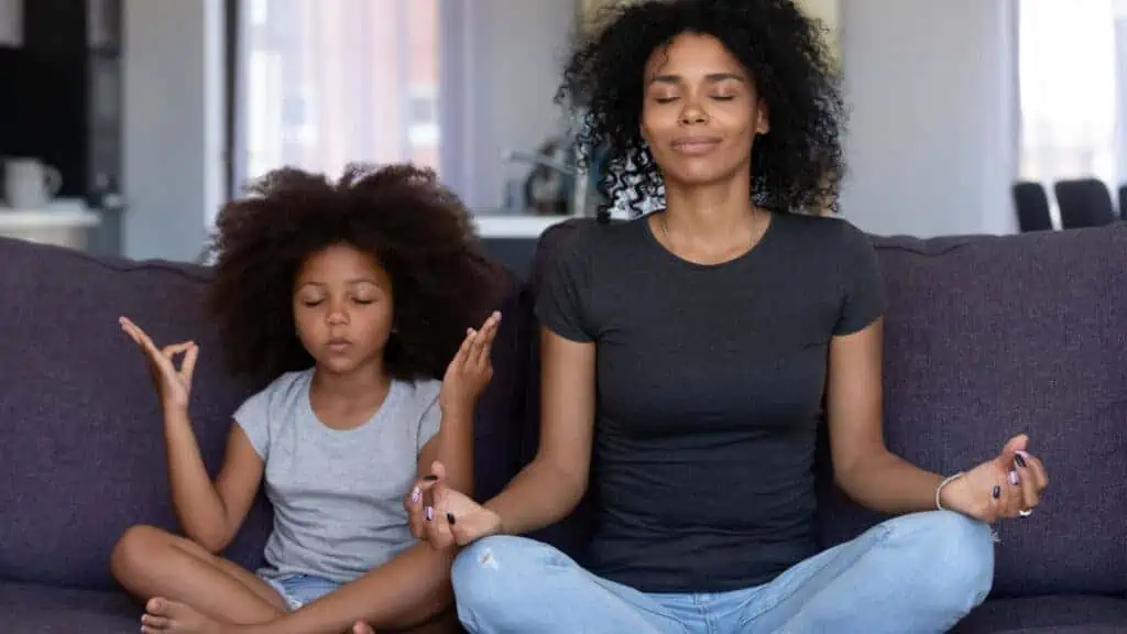 mom and girl meditating