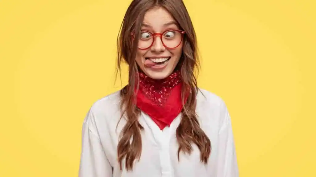 crazy woman braids glasses tongue out goofy laughing funny
