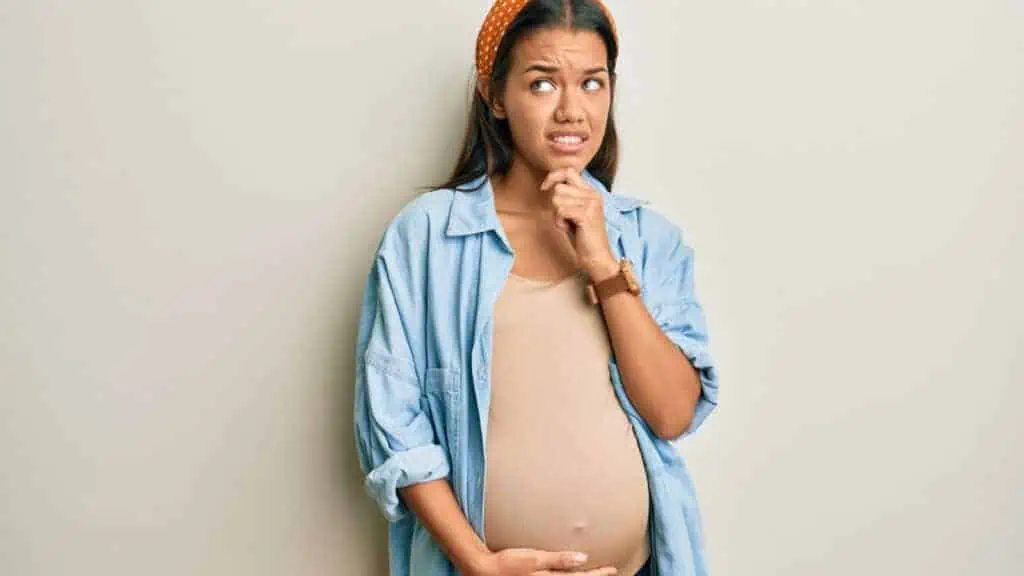 surprised confused pregnant woman