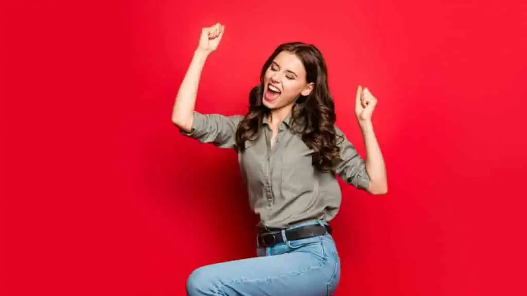 woman happy jumping red