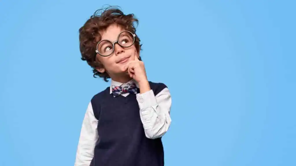 little boy in glasses smart thinking