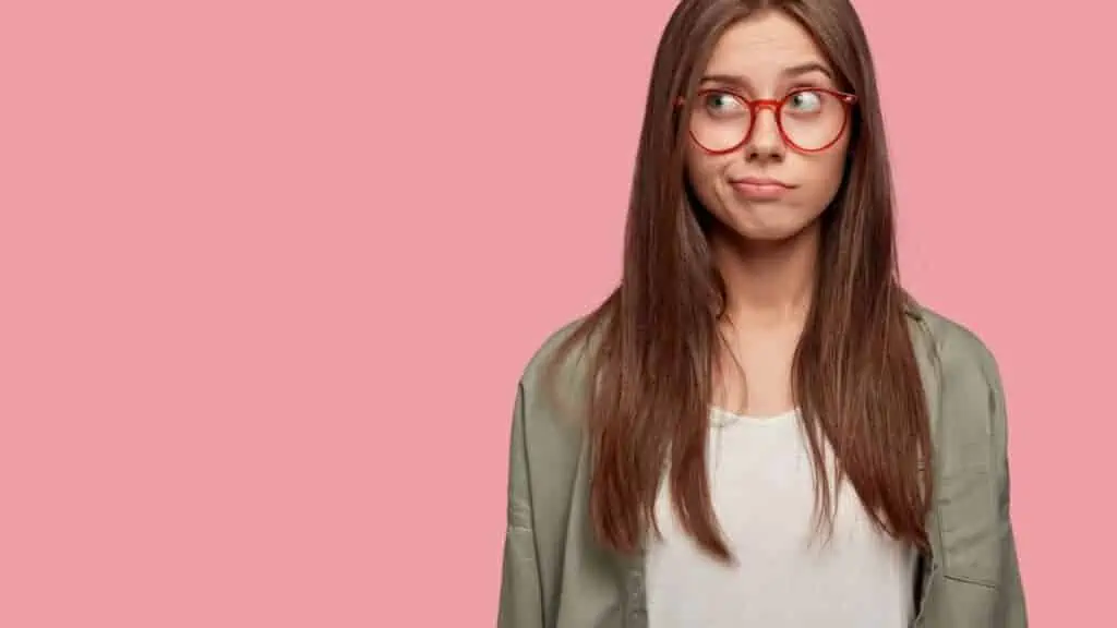 woman surprised smirk glasses