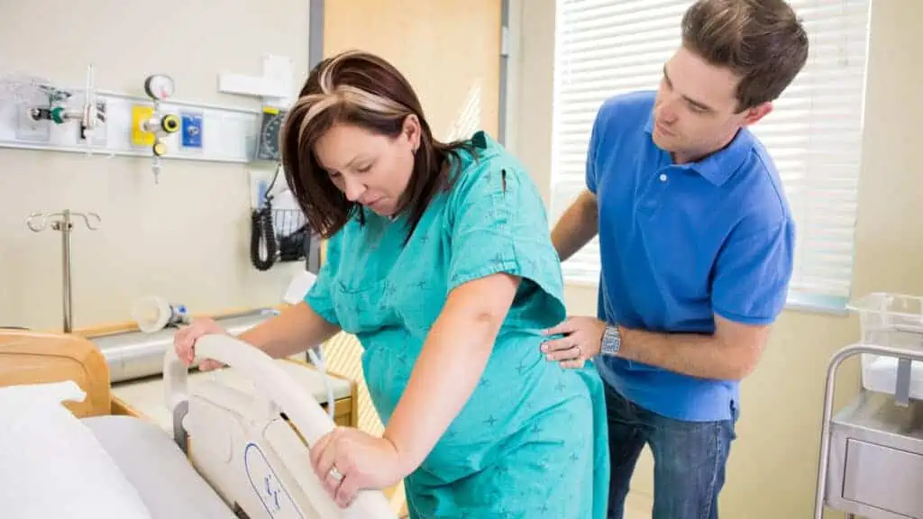 pregnant woman standing in labor