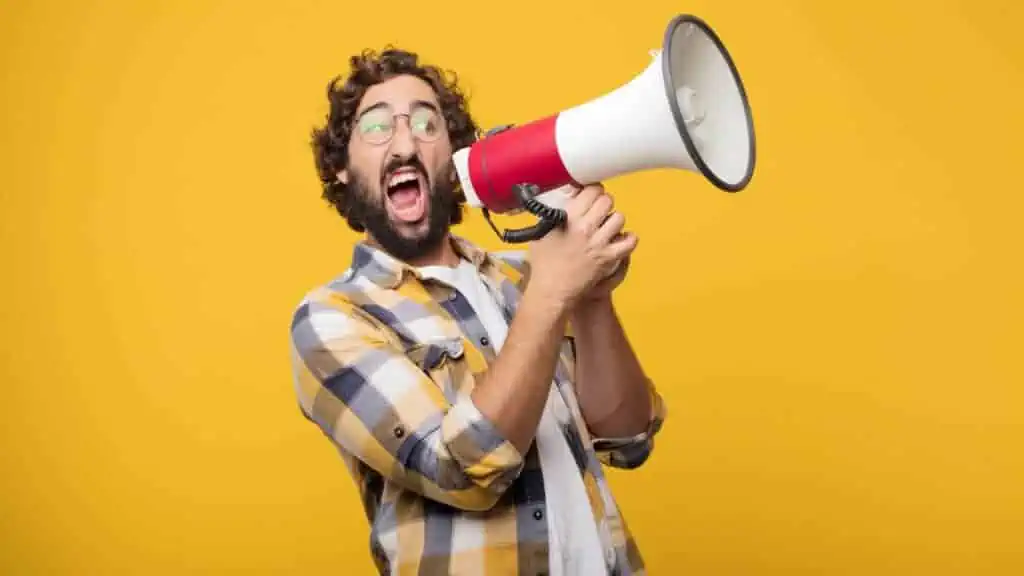 man yelling in a megaphone