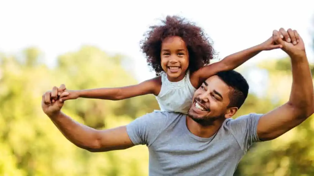 girl and her dad happy smiling