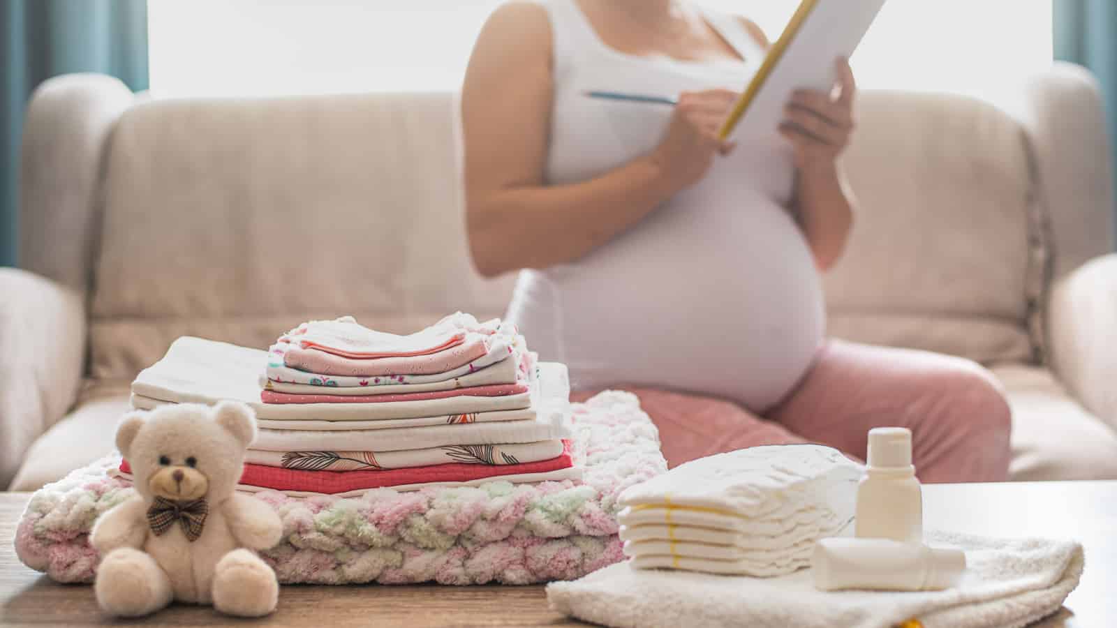 pregnant woman making a to-do list hospital bag checklist
