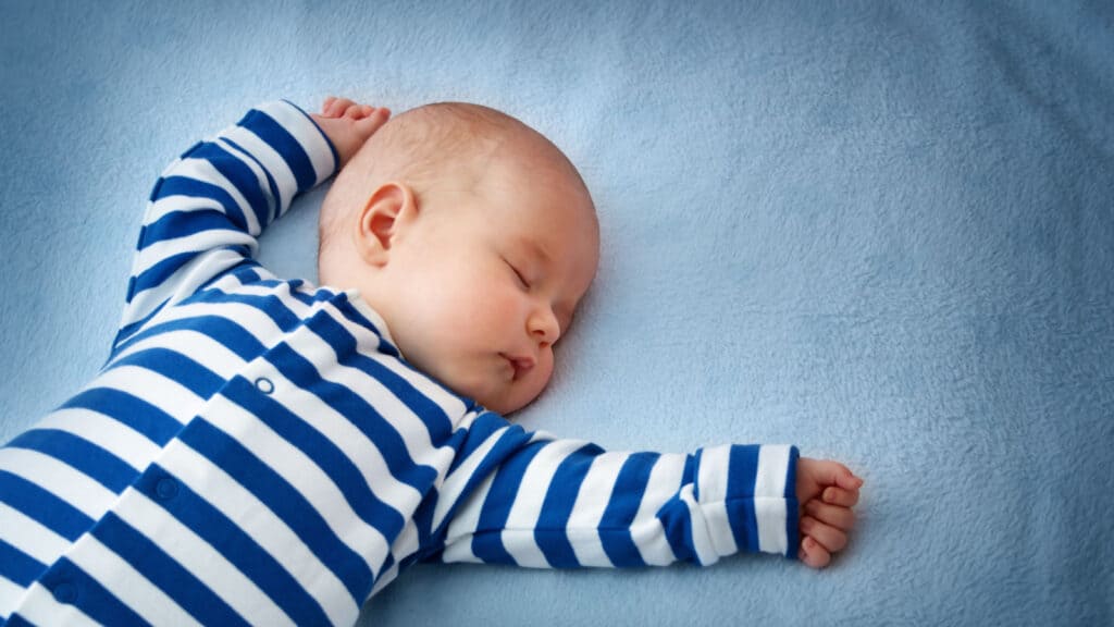 sleeping baby in stripes