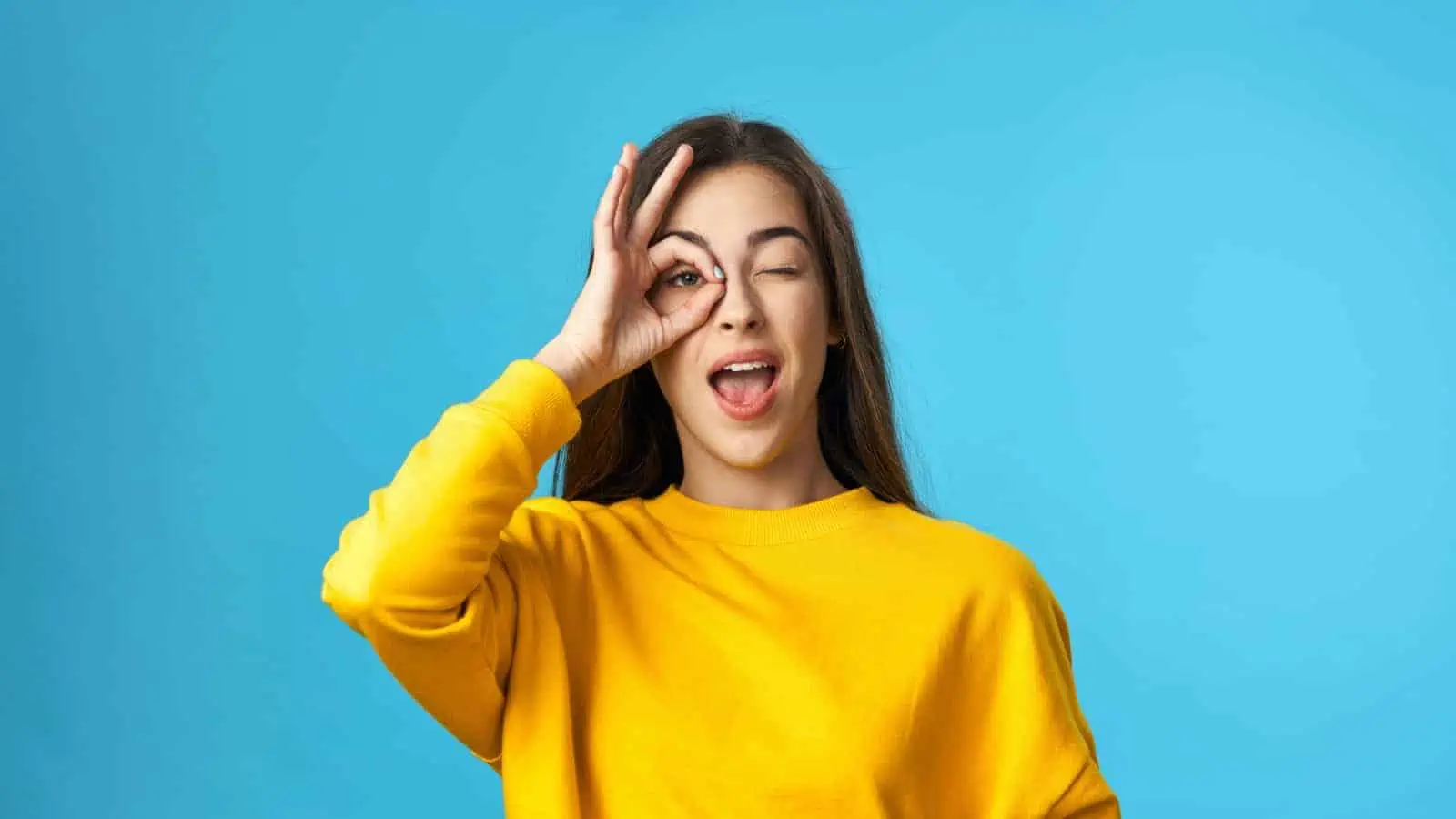 woman smiling and happy with an okay face