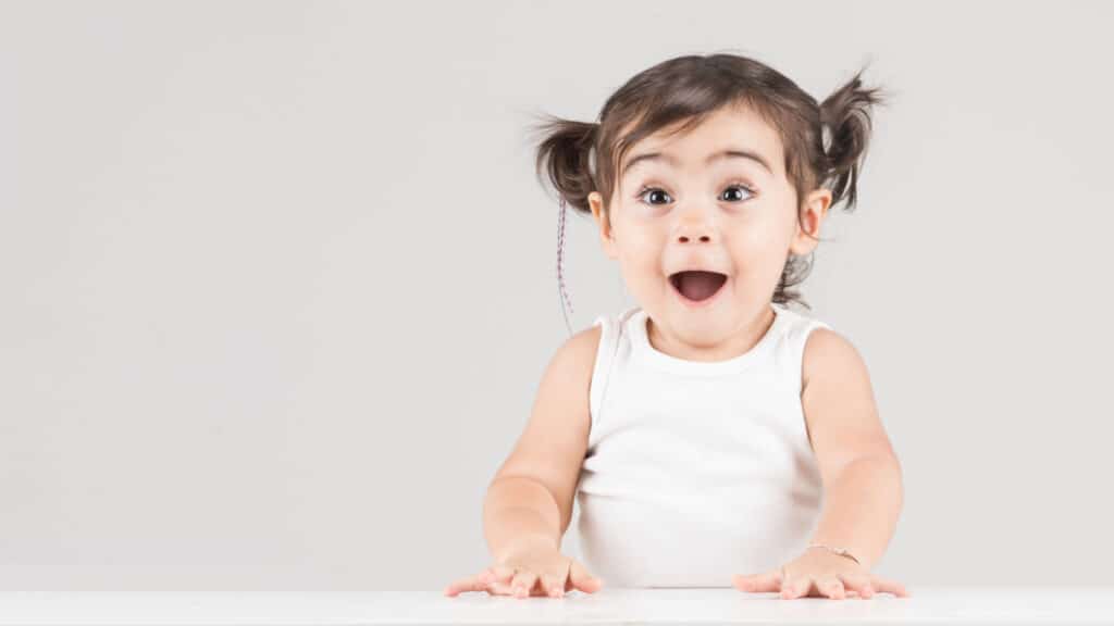 cute baby girl excited and happy