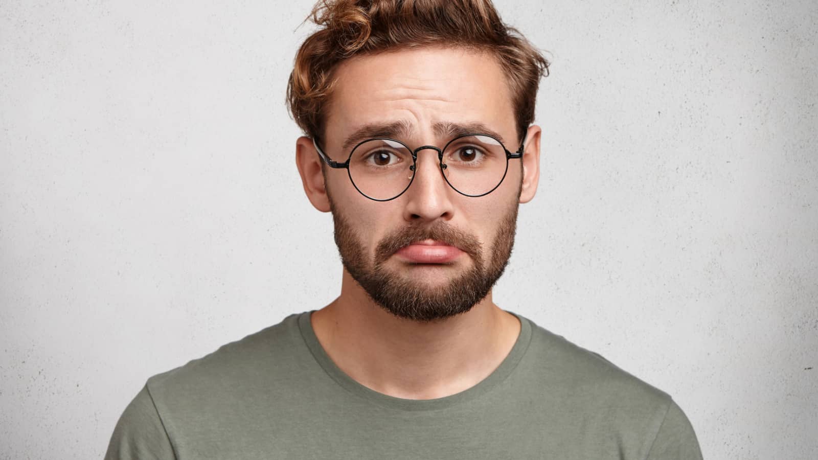 sad man frowning glasses
