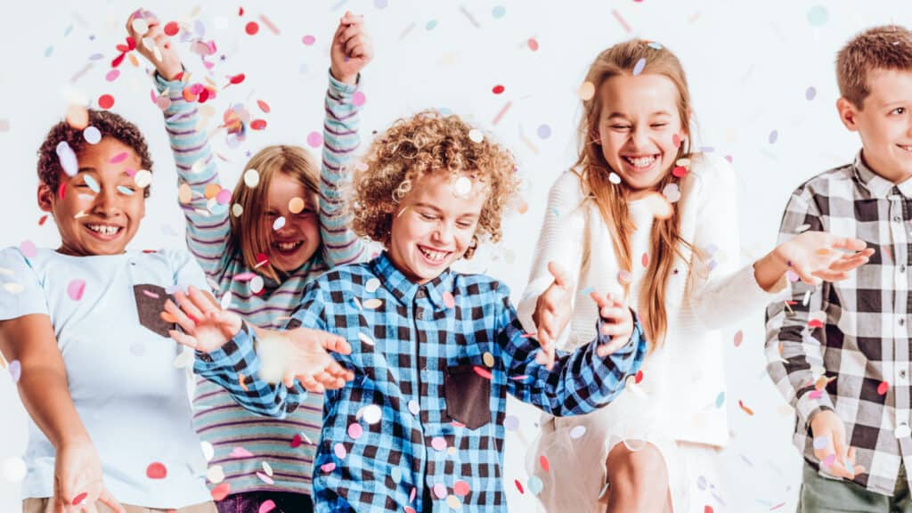 kids partying together with confetti