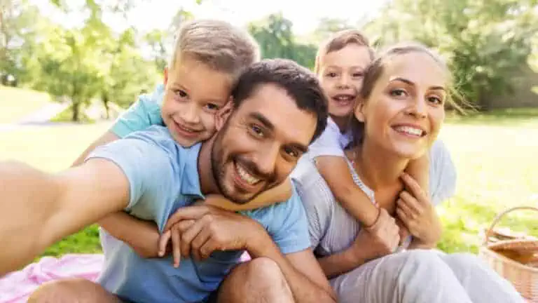 happy family of four selfie