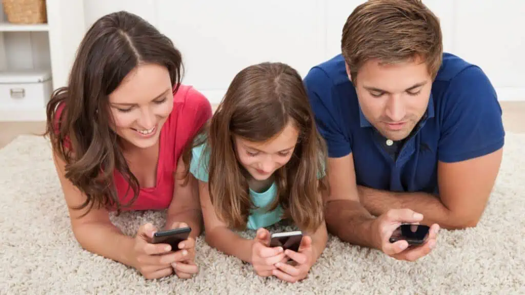 family on their phones