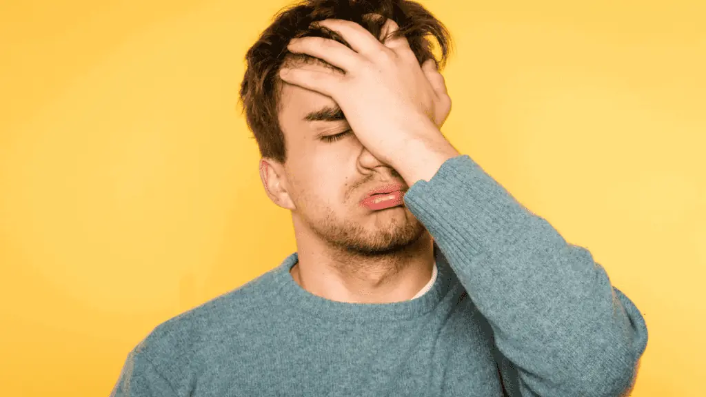 frustrated man confused palm on face