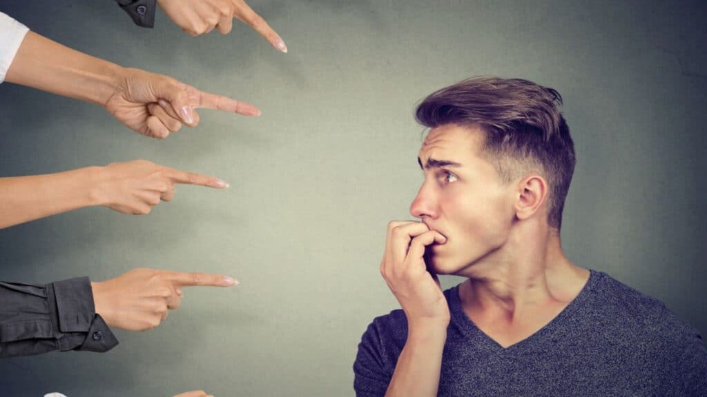 man feeling guilty fingers pointing nervous