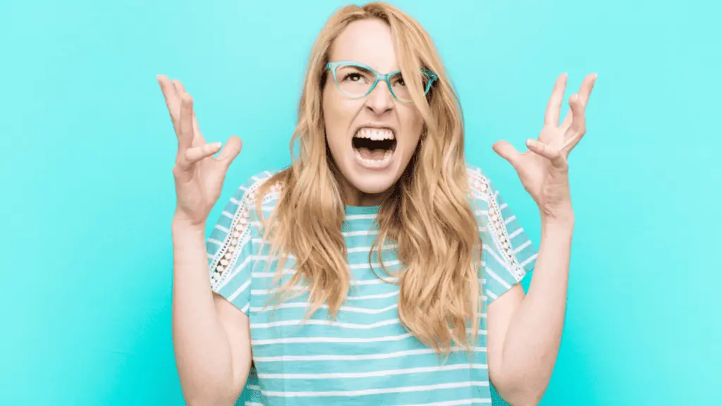 mad woman frustrated yelling green hands up glasses