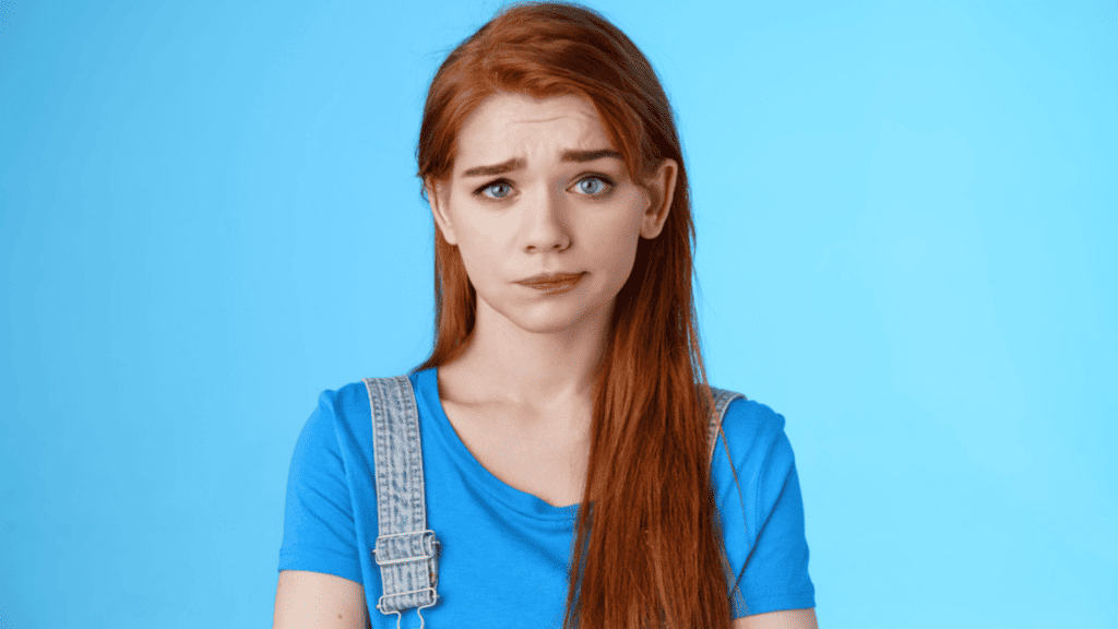eyebrow raise confused disgusted confused redhead woman