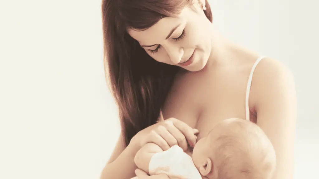 woman nursing her baby breastfeeding mom