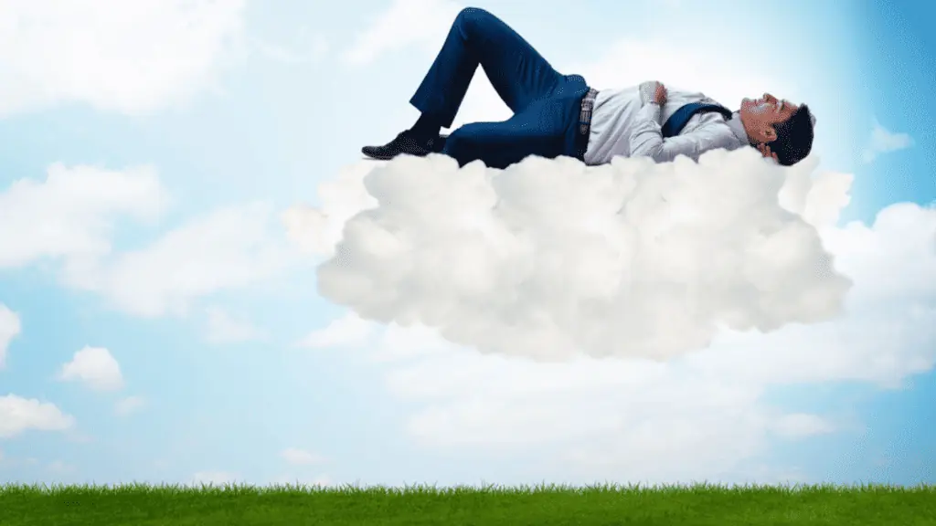 man in a cloud suit dream sleep sky green grass