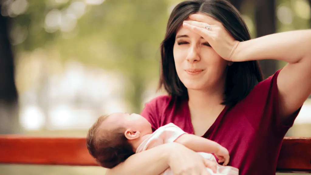 mom with a baby frustrated sad