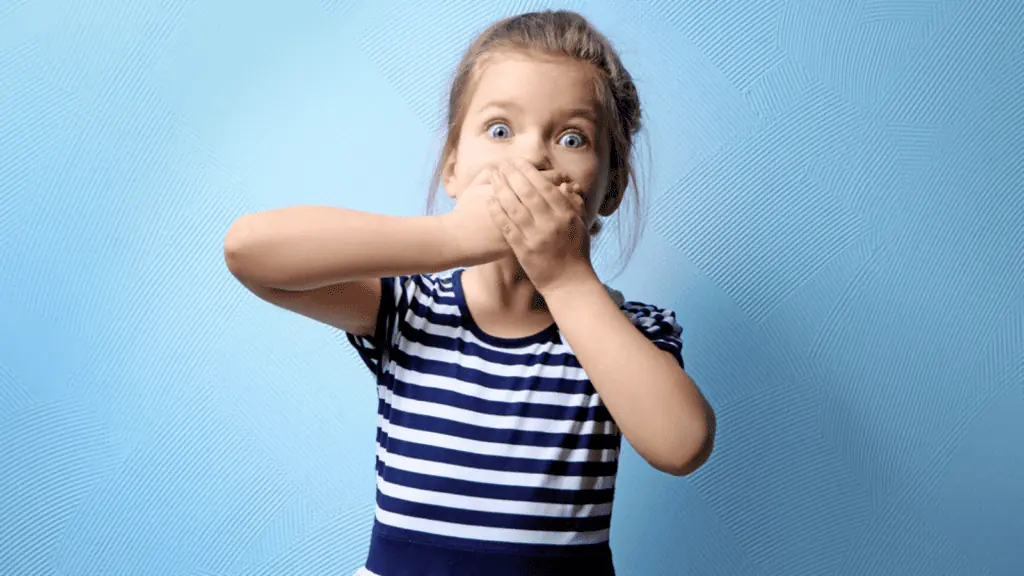 shocked girl with hands over her mouth