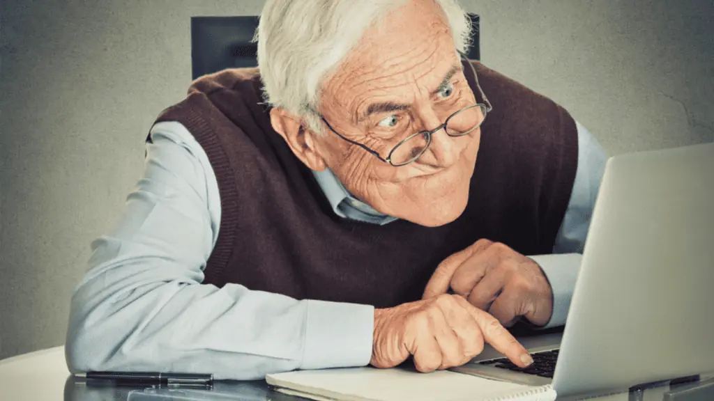 old man confused on the computer with glasses