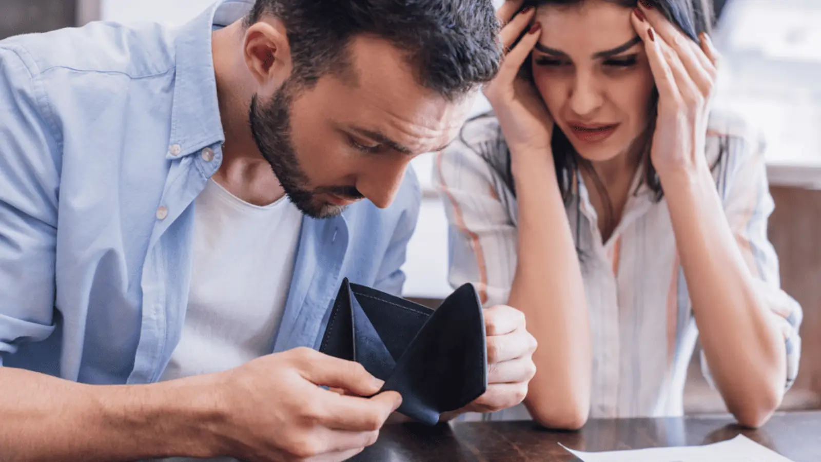 poor couple out of money debt sad